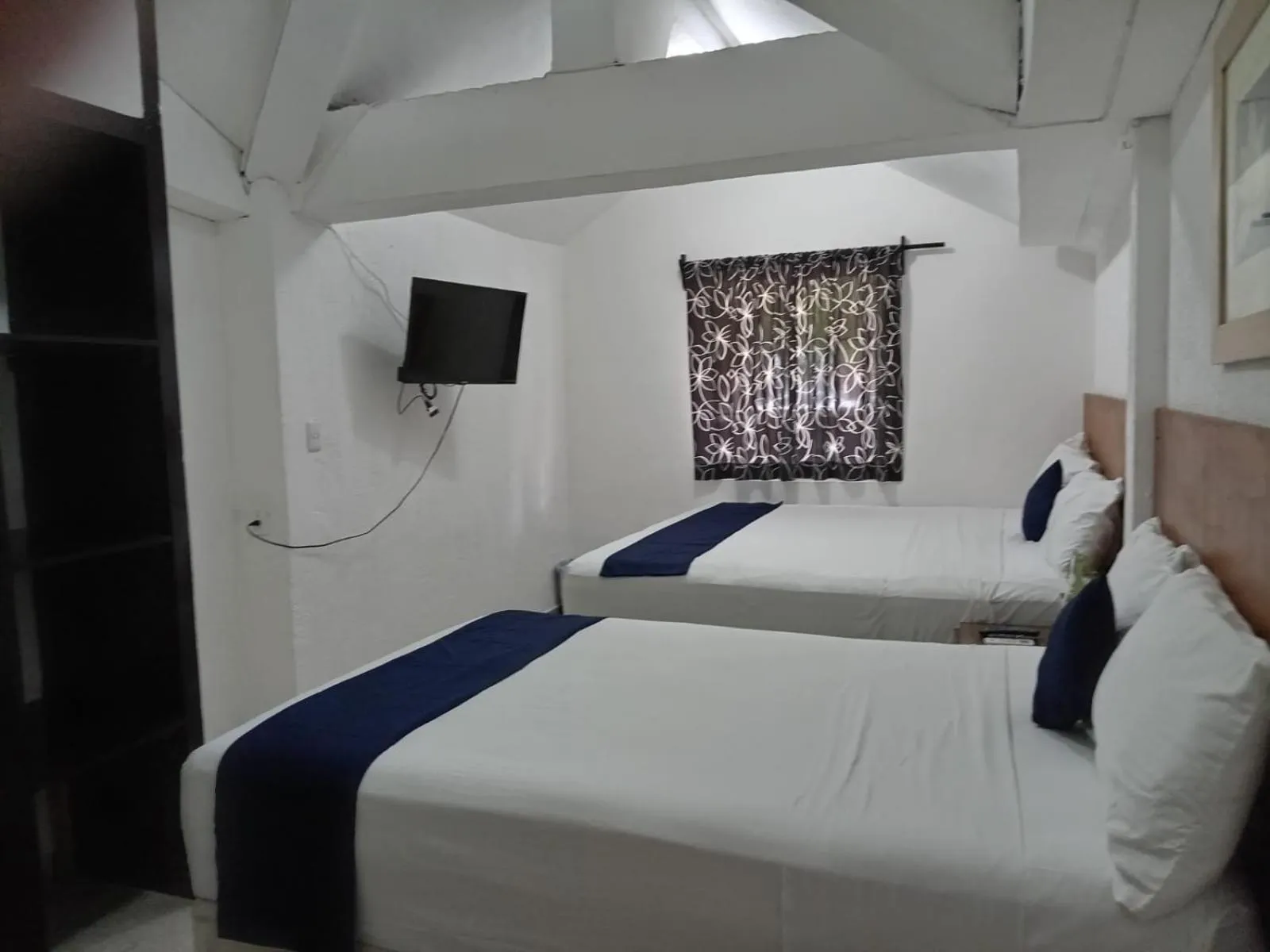 Bed in Íkaro Suites Cancún