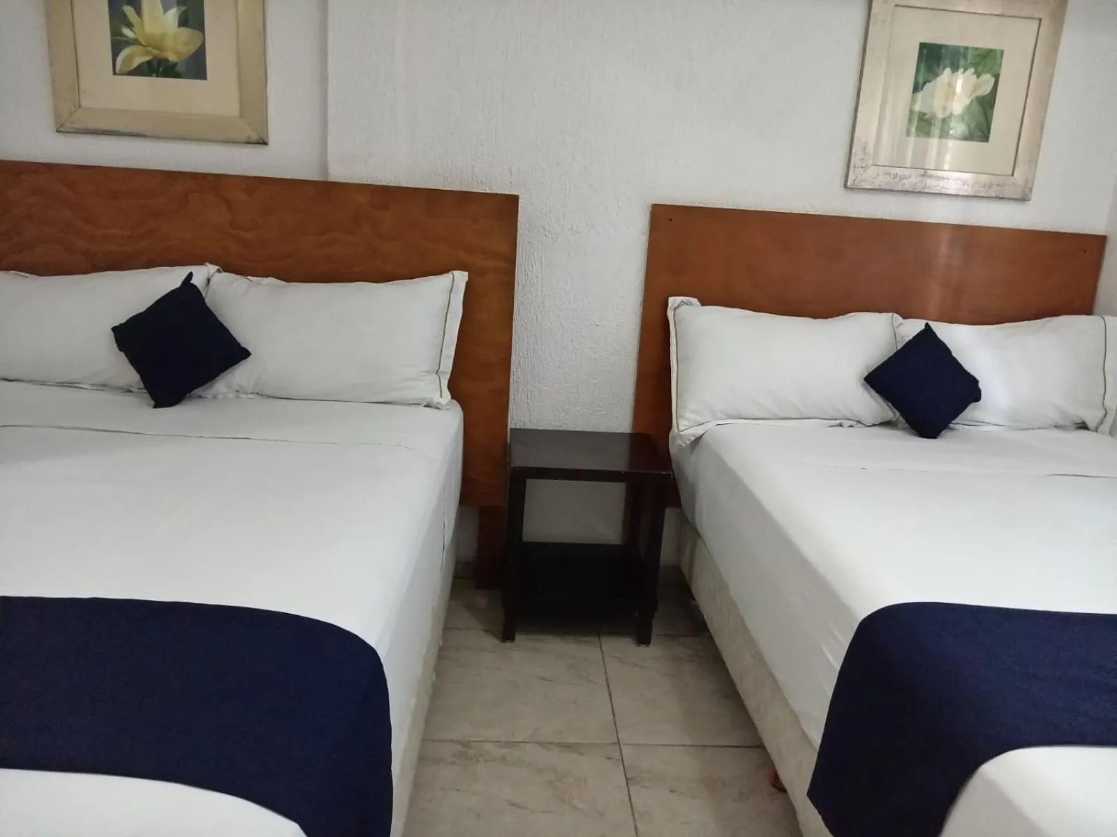Bed in Íkaro Suites Cancún