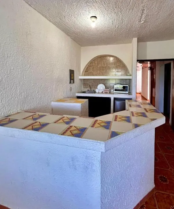 Bed in Íkaro Suites Cancún