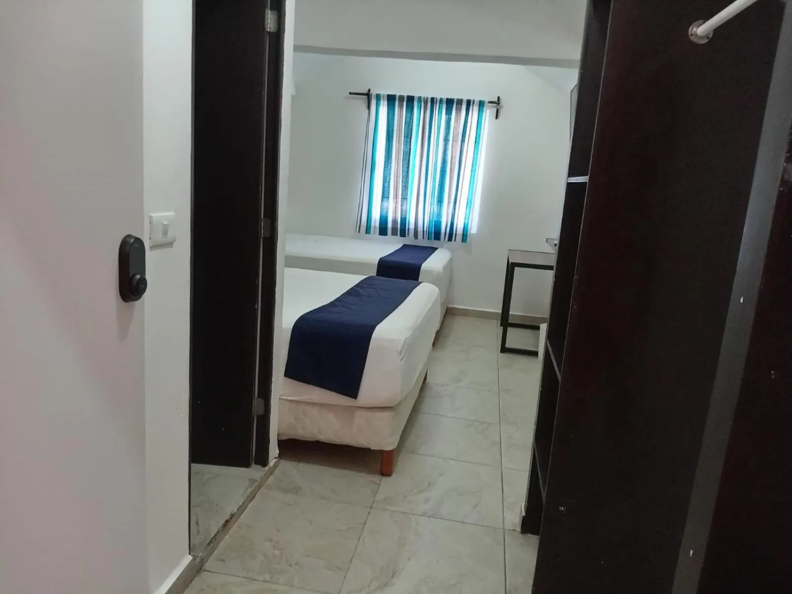 Bed in Íkaro Suites Cancún