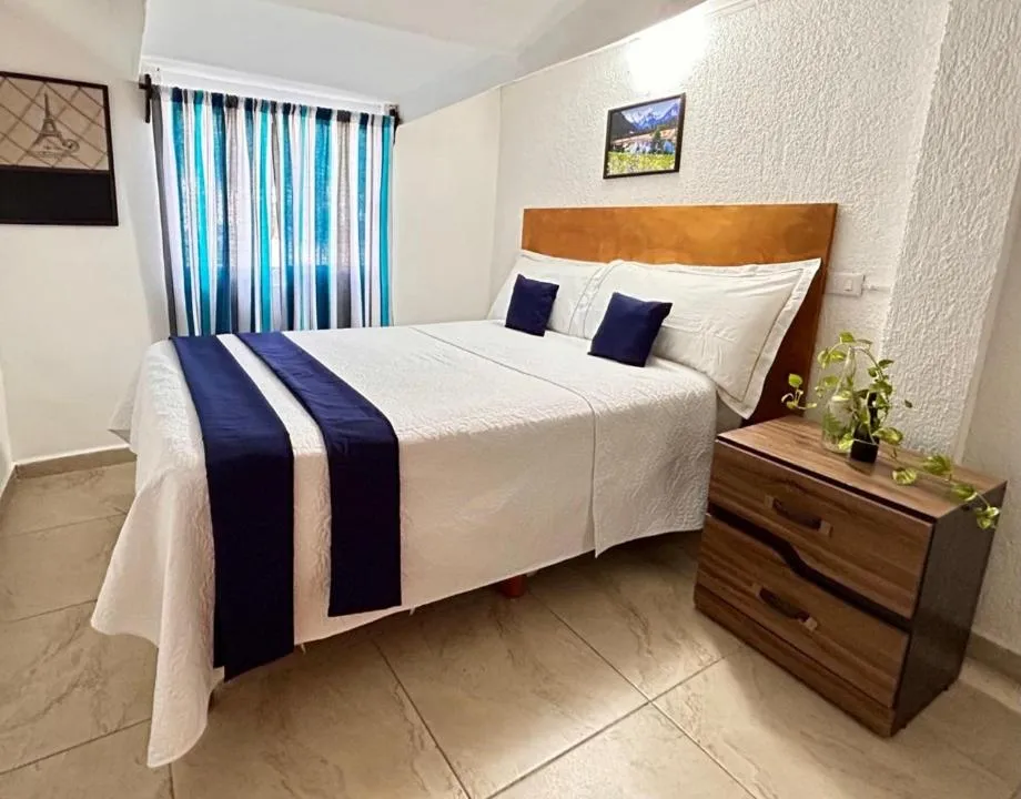 Bed in Íkaro Suites Cancún