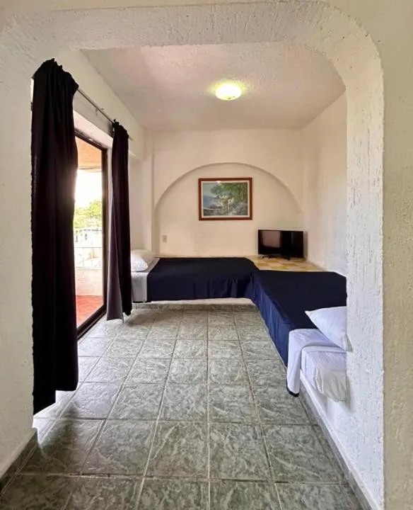 Bed in Íkaro Suites Cancún