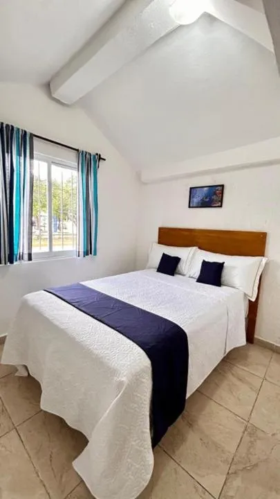 Bed in Íkaro Suites Cancún