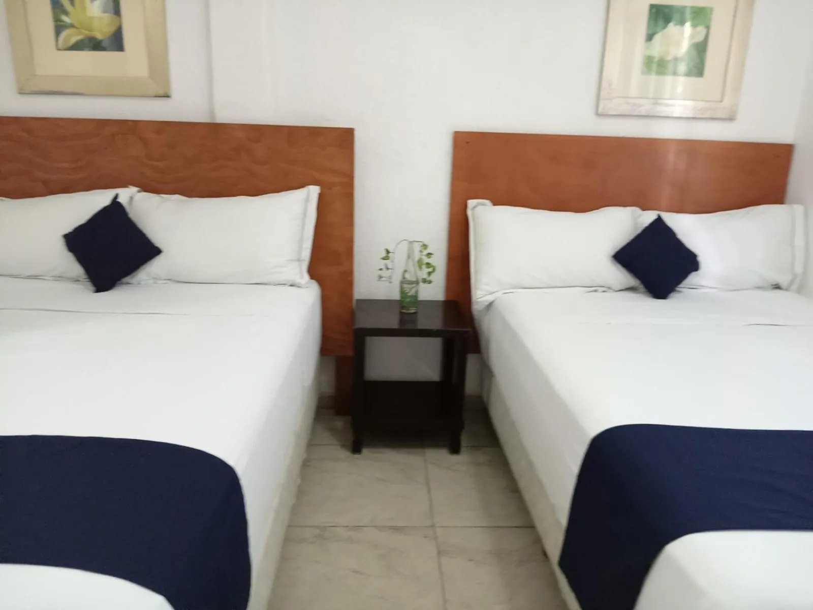 Bed in Íkaro Suites Cancún