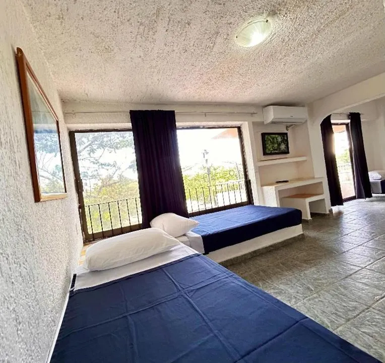 Bed in Íkaro Suites Cancún