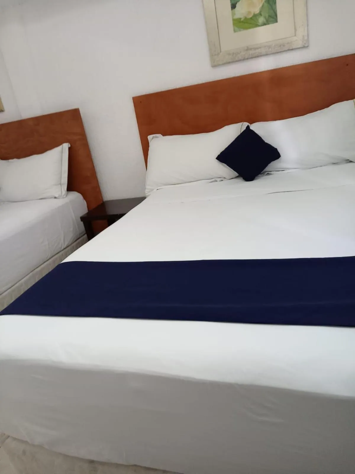 Bed in Íkaro Suites Cancún