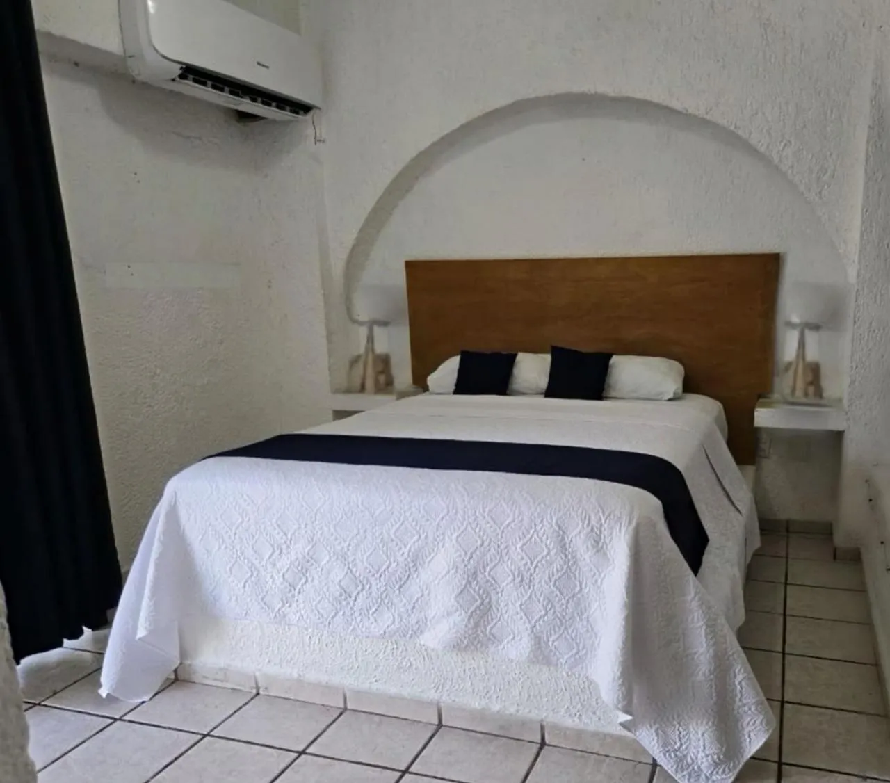 Bed in Íkaro Suites Cancún