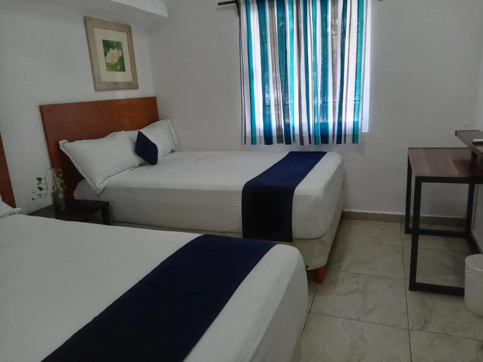 Bed in Íkaro Suites Cancún