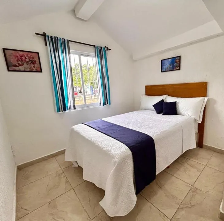 Bed in Íkaro Suites Cancún