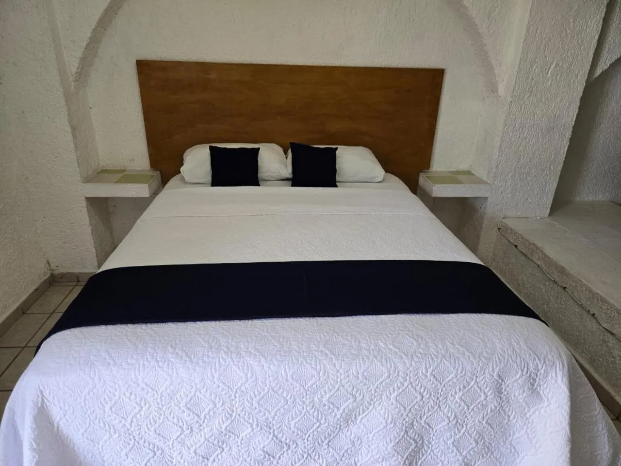 Bed in Íkaro Suites Cancún