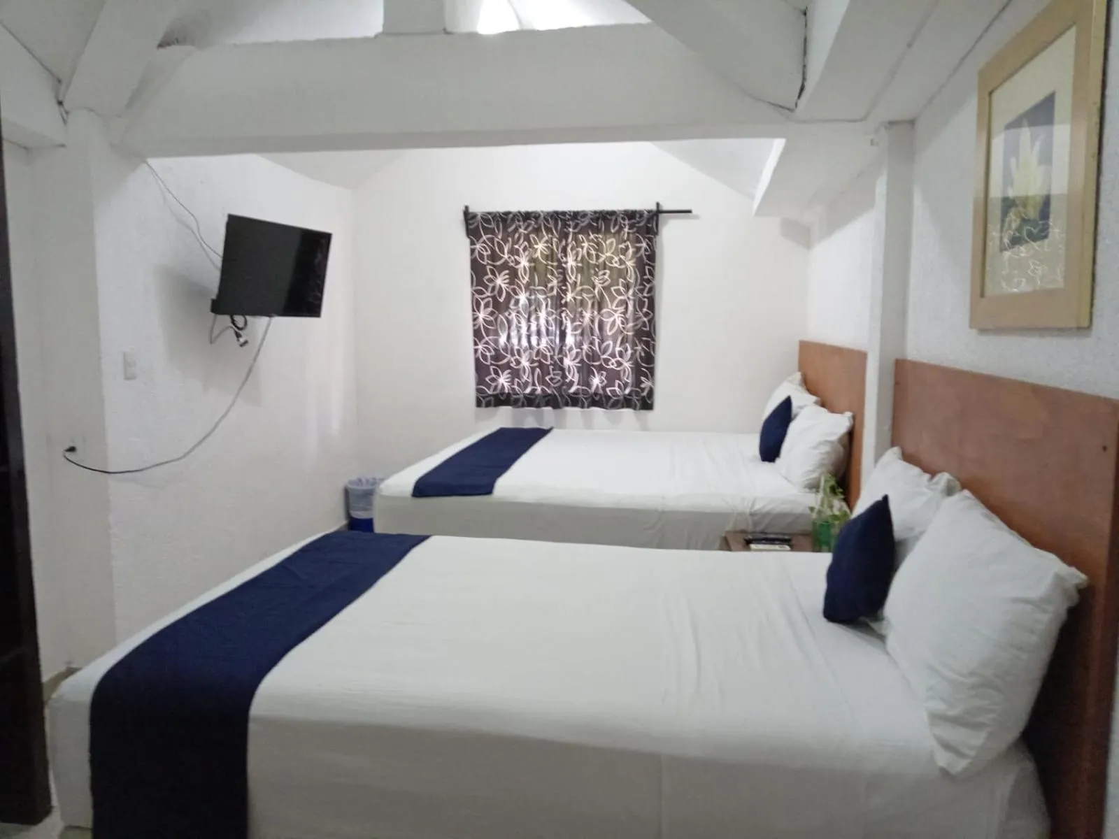 Bed in Íkaro Suites Cancún