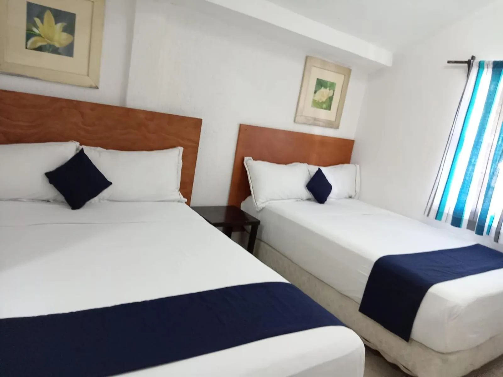 Bed in Íkaro Suites Cancún