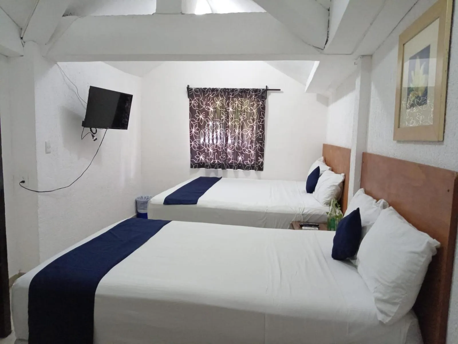 Bed in Íkaro Suites Cancún