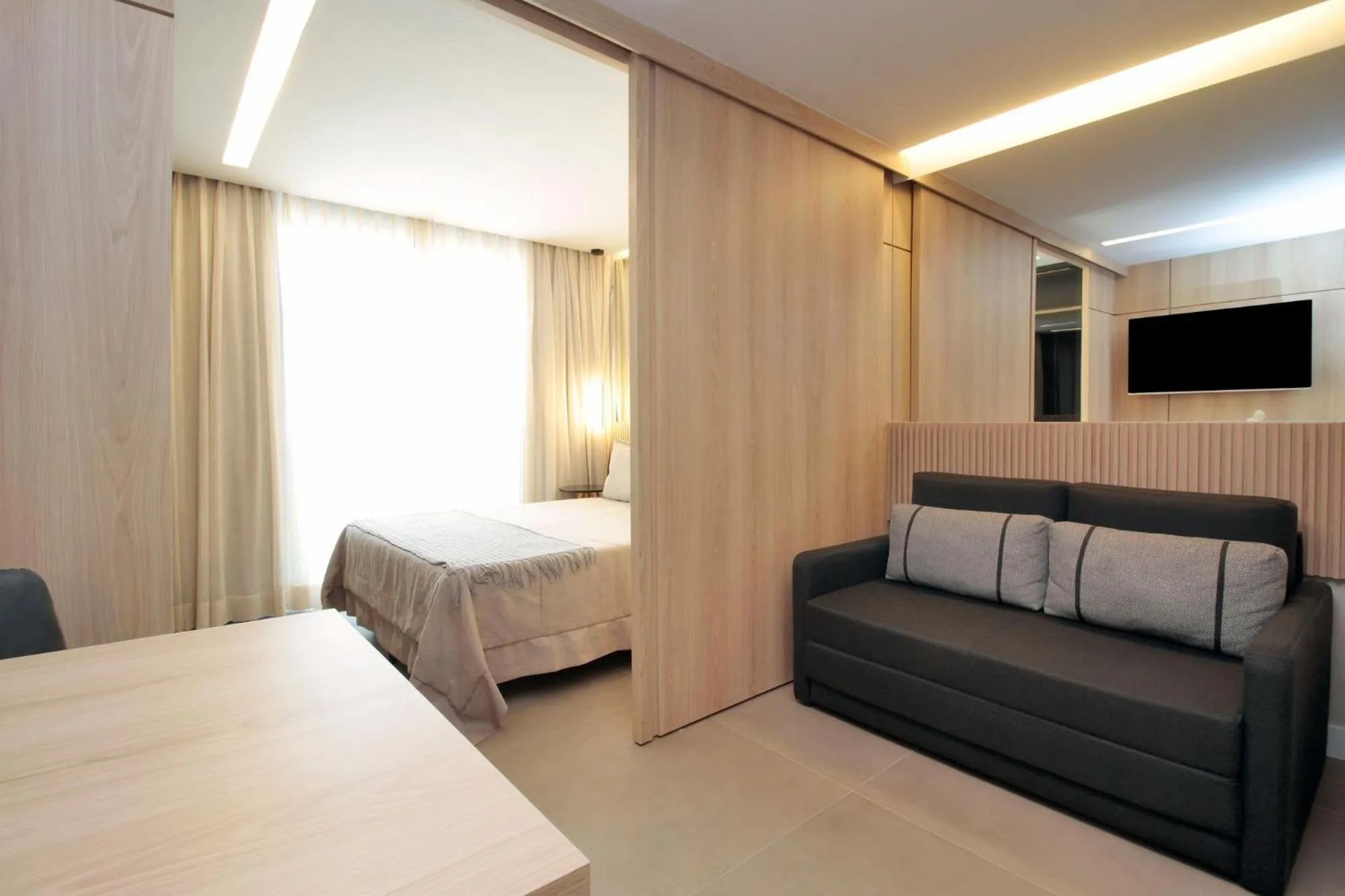 Living room, Bed in HIT Itaim