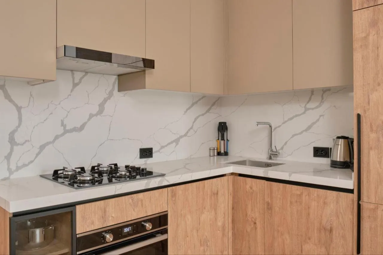 Kitchen or kitchenette in STYLO Residences & Suites