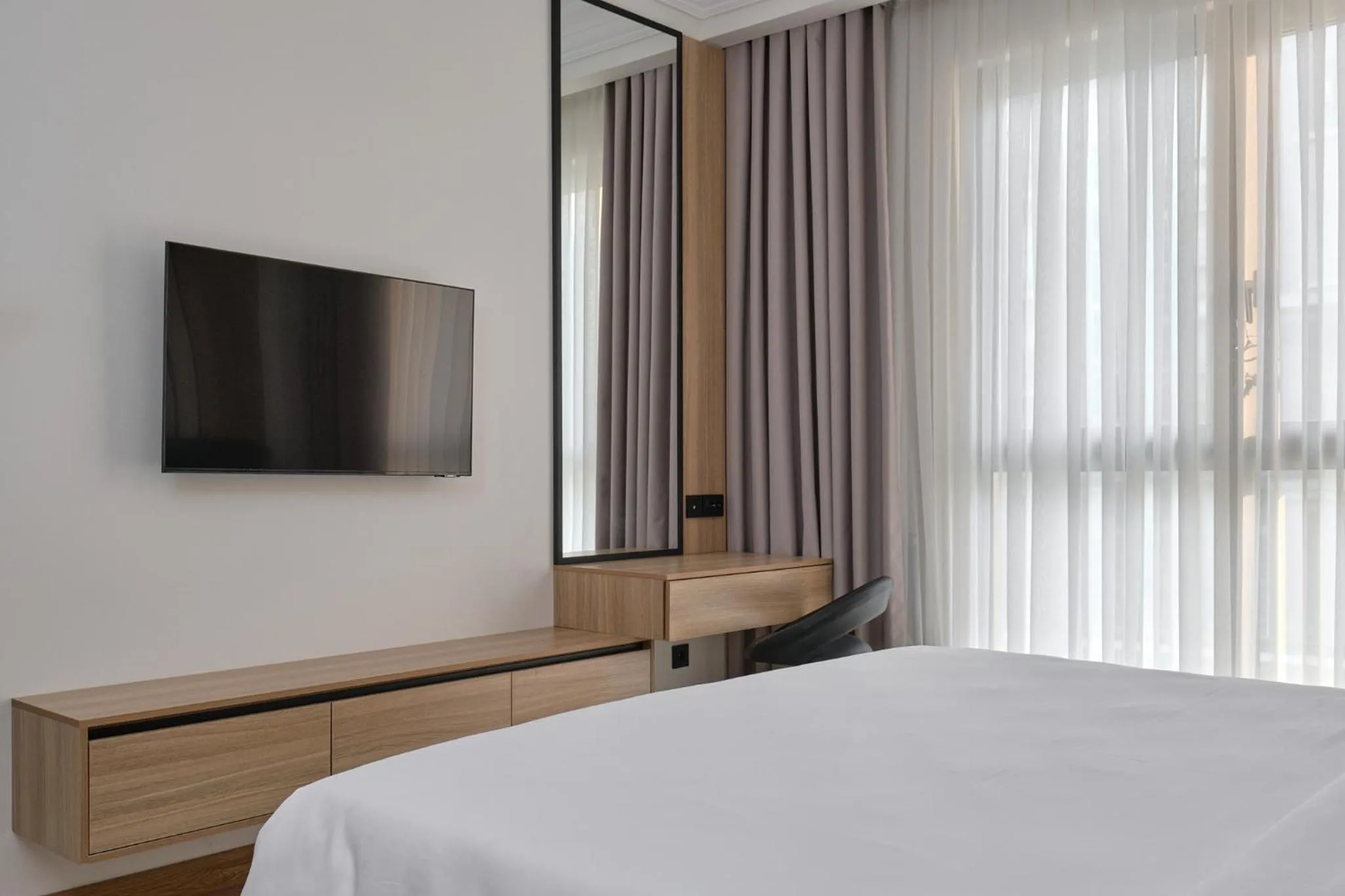 Bed in STYLO Residences & Suites