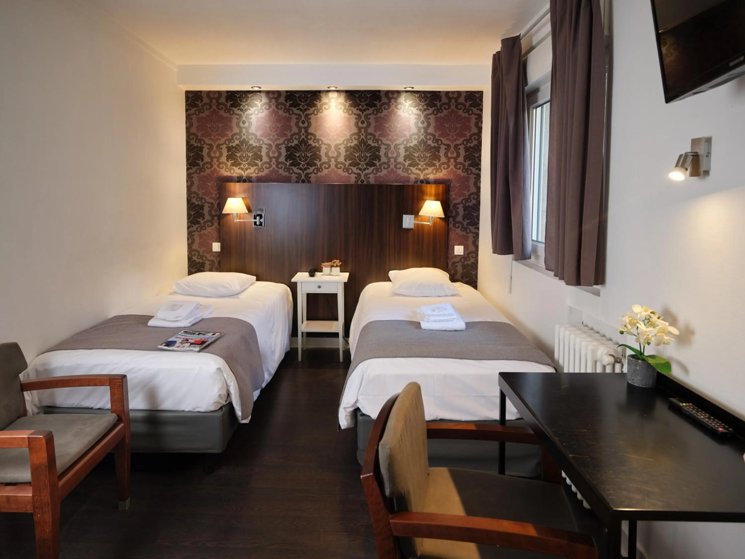 Bed in Hotel Les Negociants