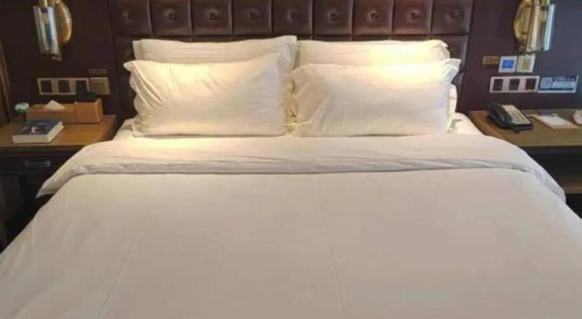 Bed in James Joyce Coffetel Shijiazhuang Wanda Plaza Tangu Metro Station