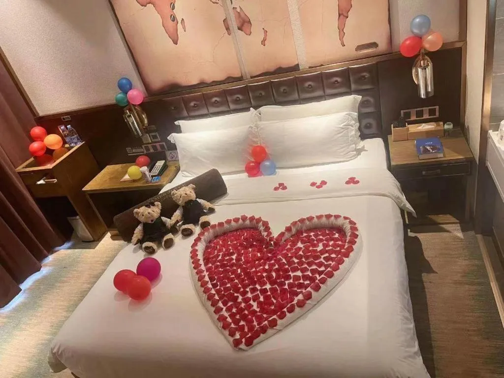 Bed in James Joyce Coffetel Shijiazhuang Wanda Plaza Tangu Metro Station