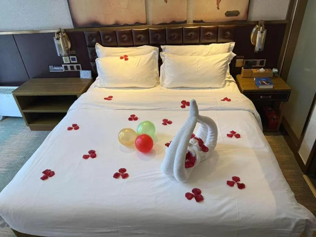 Bed in James Joyce Coffetel Shijiazhuang Wanda Plaza Tangu Metro Station