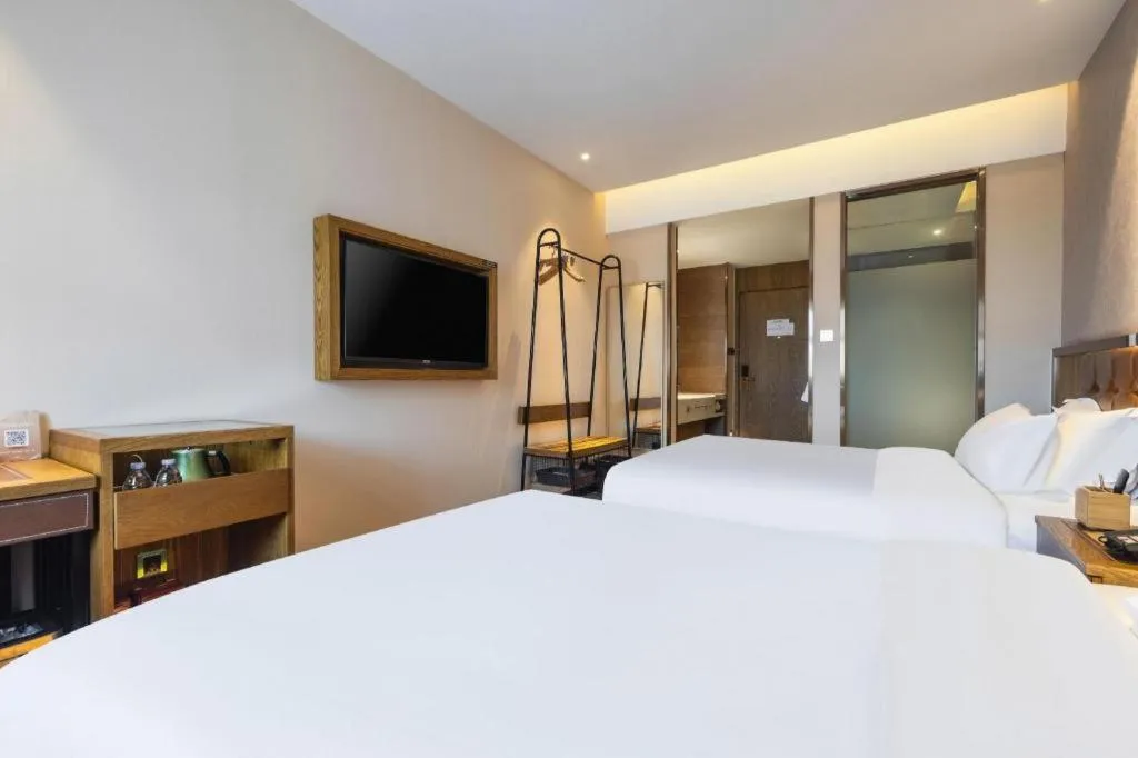 Bed in James Joyce Coffetel Tianjin Railway Station