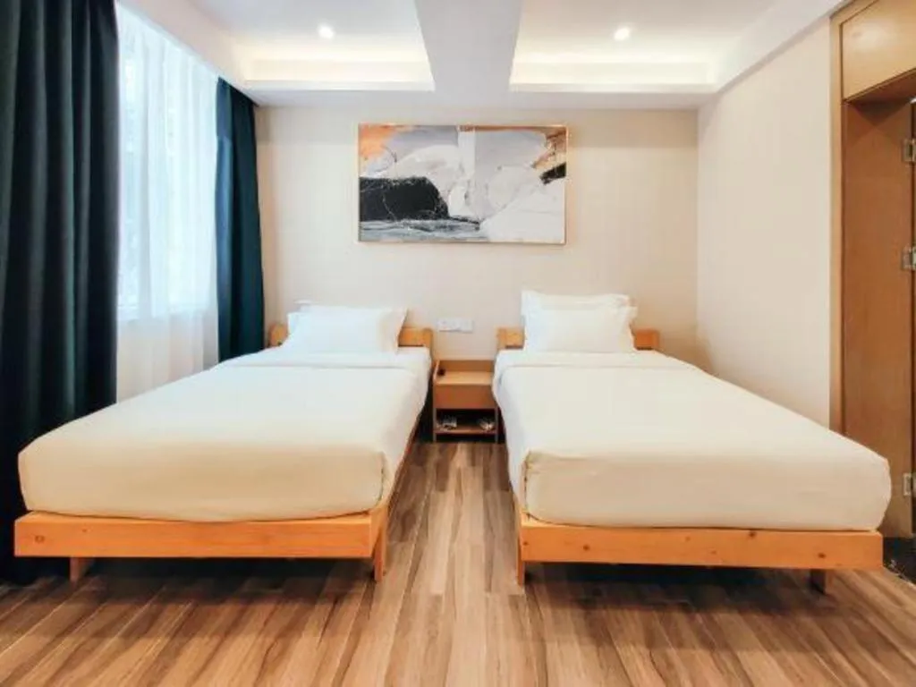 Bed in ZMAX Hotels Wuhan East Lake