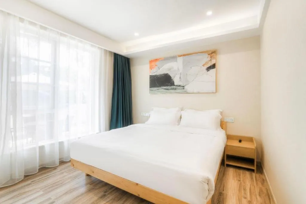 Bed in ZMAX Hotels Wuhan East Lake