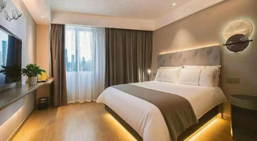 Bed in Magnotel Hotel Wuhan Jiangtan Lihuangpo Road Pedestrian Street
