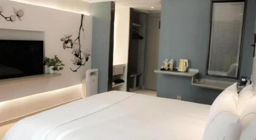 Bed in Magnotel Hotel Wuhan Jiangtan Lihuangpo Road Pedestrian Street