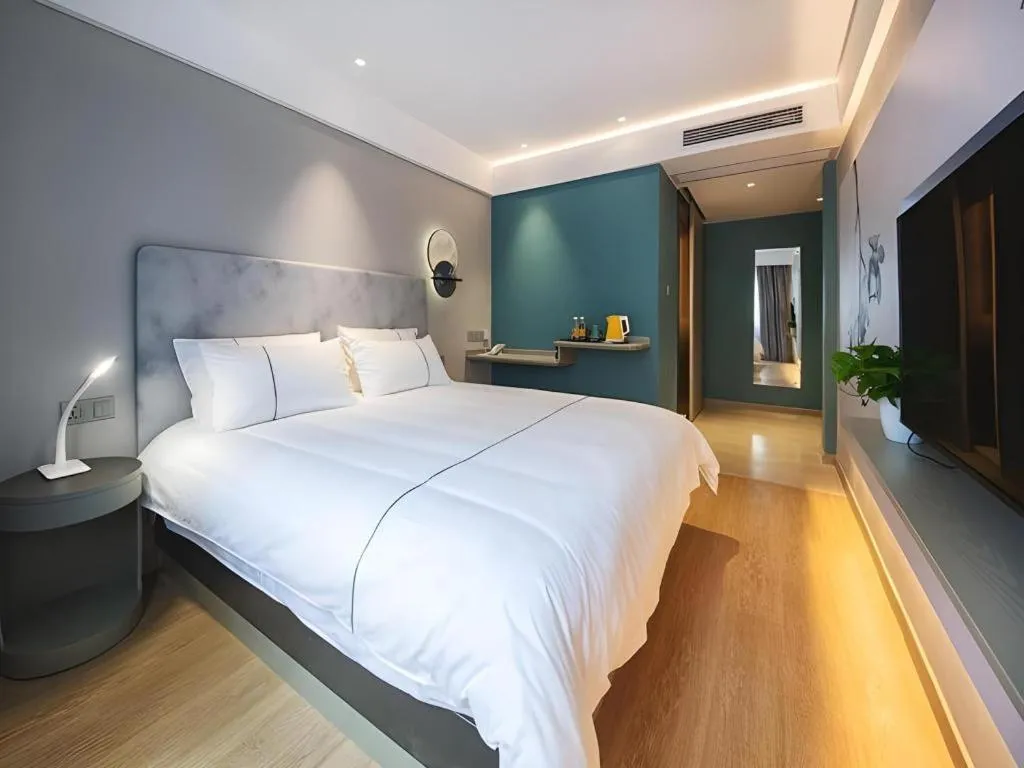 Bed in Magnotel Hotel Wuhan Jiangtan Lihuangpo Road Pedestrian Street