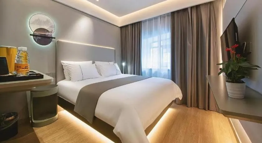 Bed in Magnotel Hotel Wuhan Jiangtan Lihuangpo Road Pedestrian Street