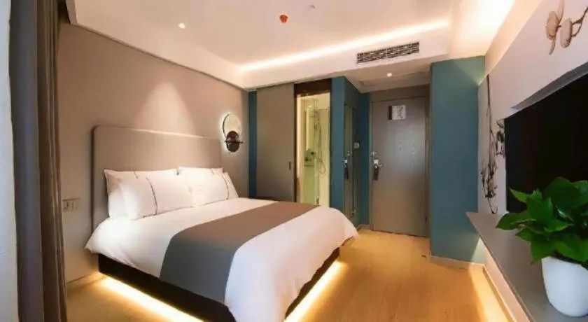 Bed in Magnotel Hotel Wuhan Jiangtan Lihuangpo Road Pedestrian Street