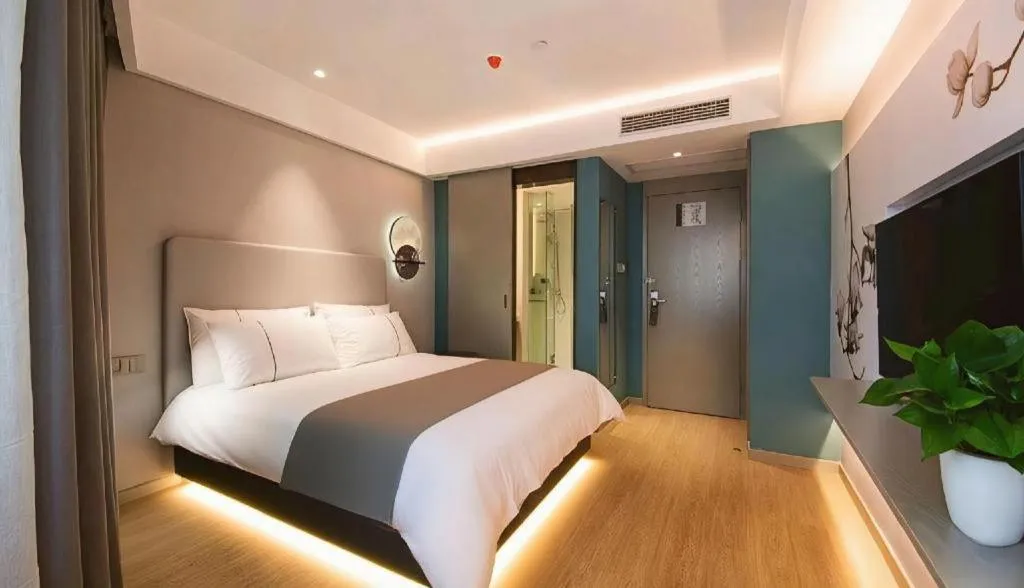 Bed in Magnotel Hotel Wuhan Jiangtan Lihuangpo Road Pedestrian Street