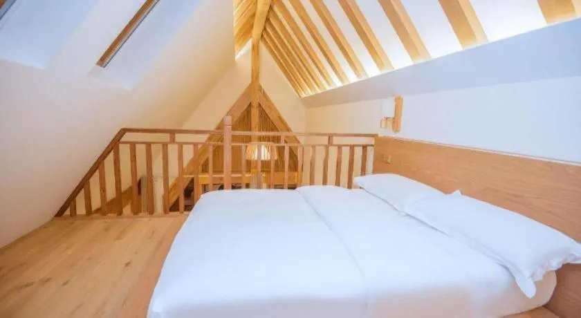 Bed in Ramada by Wyndham Guergou