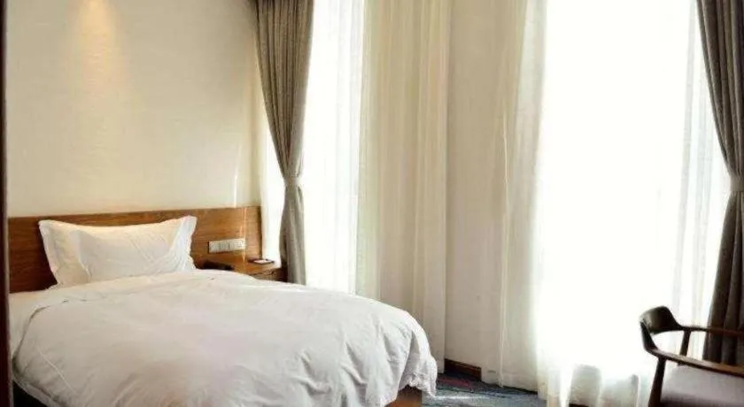 Bed in Ramada by Wyndham Guergou