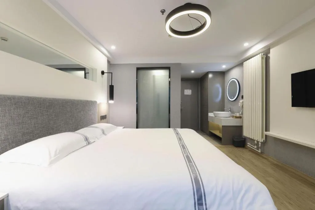 Bed in Urban Garden Hotel Chengyang District Government Liuting Airport