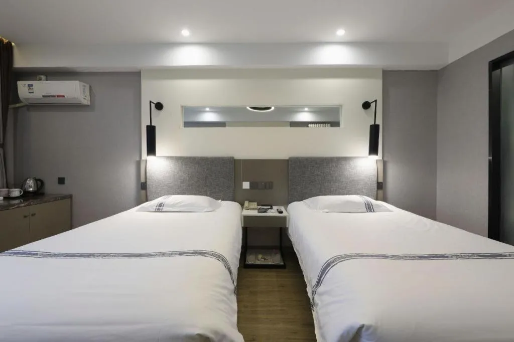 Bed in Urban Garden Hotel Chengyang District Government Liuting Airport