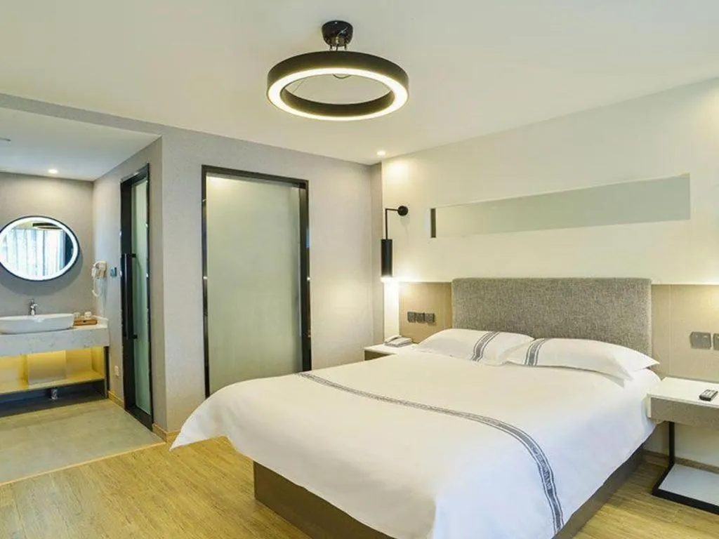 Bed in Urban Garden Hotel Chengyang District Government Liuting Airport