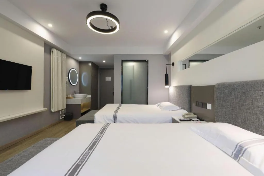 Bed in Urban Garden Hotel Chengyang District Government Liuting Airport