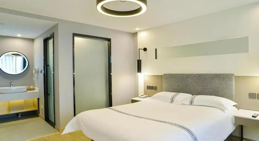 Bed in Urban Garden Hotel Chengyang District Government Liuting Airport
