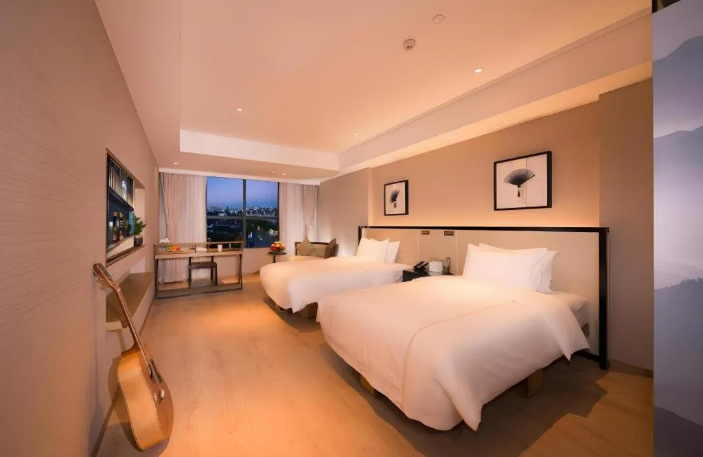 Bed in The Hotel V Nanjing Confucius Temple