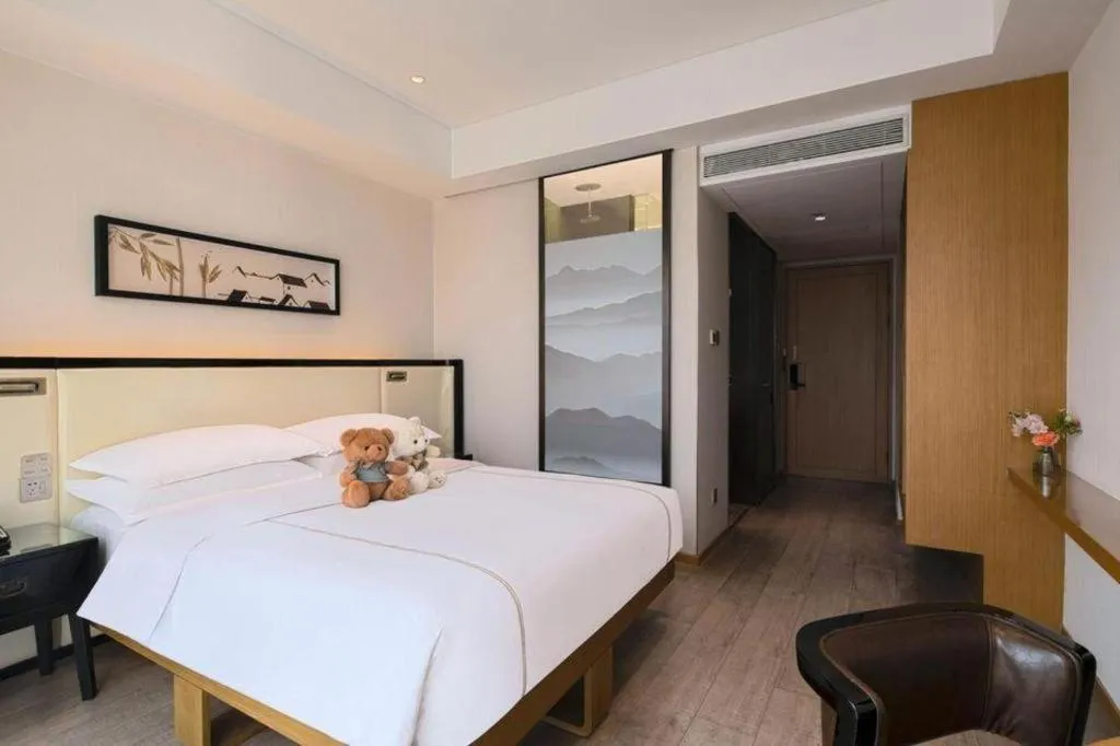 Bed in The Hotel V Nanjing Confucius Temple