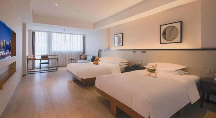 Bed in The Hotel V Nanjing Confucius Temple