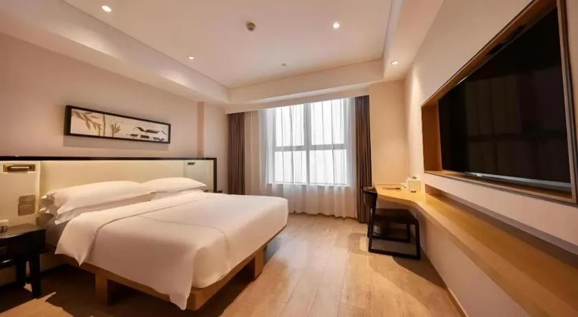 Bed in The Hotel V Nanjing Confucius Temple