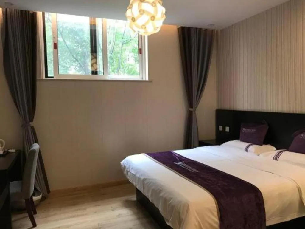 Bed in City 118 Hotel Qingdao Boardcast Tower