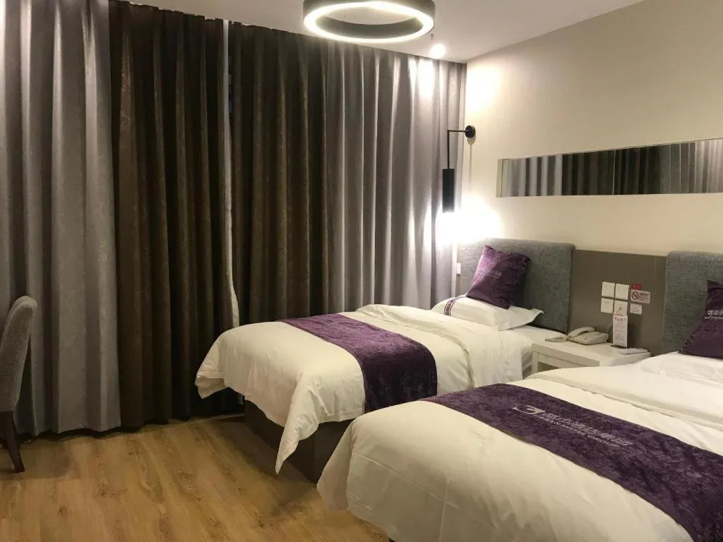 Bed in City 118 Hotel Qingdao Boardcast Tower