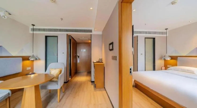 Bed in Borrman Hotel Zhanjiang Wuchuan Jinsha Plaza