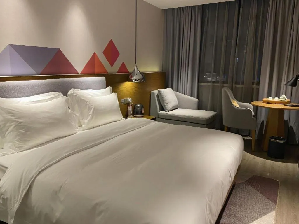 Bed in Borrman Hotel Zhanjiang Wuchuan Jinsha Plaza