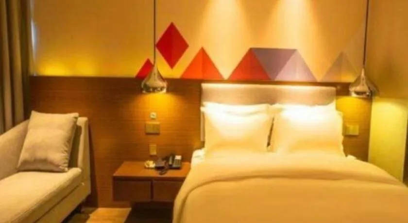Bed in Borrman Hotel Zhanjiang Wuchuan Jinsha Plaza