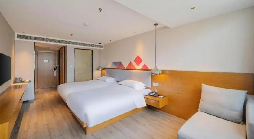 Bed in Borrman Hotel Zhanjiang Wuchuan Jinsha Plaza